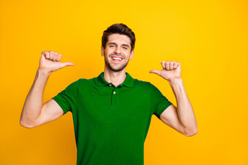Portrait of his he nice attractive lovely content cheerful cheery guy wearing lilac shirt pointing...