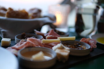Cheese, meat, grapes and olives antipasto. Appetizer selection on plate. Top view with copy space. Flat lay. High quality photo