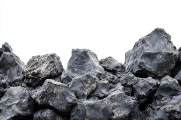 Rocks and stones arranged on white background - A collection of rugged rocks stacked together symbolizing nature, strength, resilience, stability