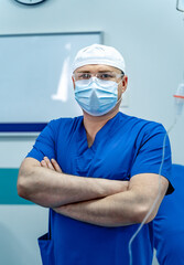Surgical professional. A confident healthcare professional in scrubs and gear stands ready for...