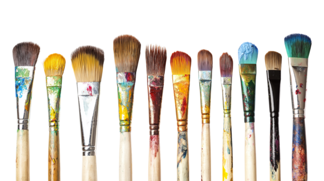 Set of paintbrushes with dried paint on bristles, artistic tools for painters and creatives, isolated on a white background