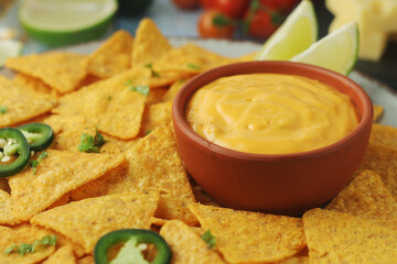 Corn tortilla chips with cheese sauce