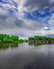 Obraz premium Body of water with a bridge in the background