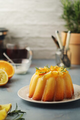 A sweet citrus cake served with oranges and lemons	