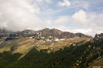 early spring in the mountains, the last snow is melting in the valley
