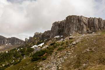 early spring in the mountains, the last snow is melting in the valley