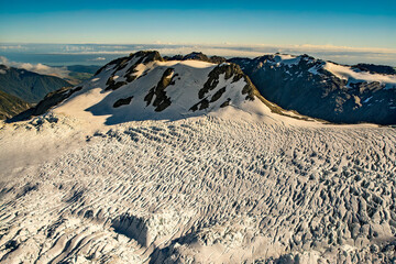 Flying over the southern alps mountain range snow covered peaks
