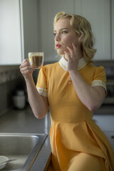 Beautiful blonde girl drinking coffee, vintage beauty, classic pinup style girl