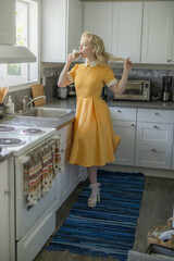 Beautiful blonde girl drinking coffee, vintage beauty, classic pinup style girl