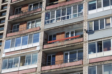 Urban architecture with multiple windows and balconies.