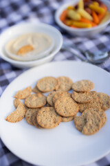 Crackers and hummus, appetizer plate, picnic food