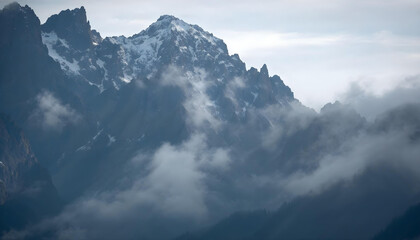 mountain landscape with clouds and snow