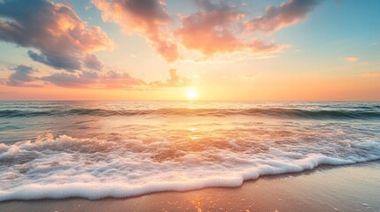 Fototapeta premium Serene sunset over ocean waves on sandy beach.