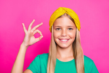 Close up photo of positive cheerful kid future promoter show ok sign recommend tips ads wear trend...