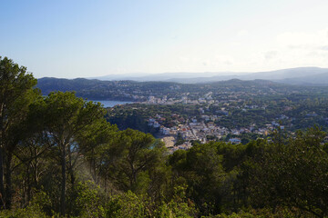 Naklejka premium view from the viewpoint at the lighthouse Far de Sant Sebastia over the landscape at the Costa Brava with the white villages Llafranc and Calella de Palafrugell, Catalonia, Spain