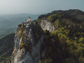 small church on top of mountain, overlooking the valley,aerial view,overall plan