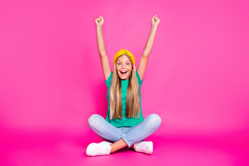 Full length photo of cheerful positive child raise her fists scream yeah watch sports competition...