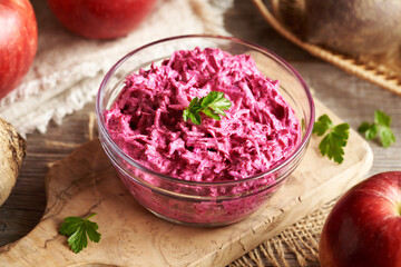 Red beet salad with fresh apples and sour cream