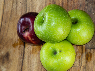red apples on wooden table