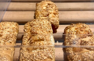 A delightful closeup image of scrumptious sesame pastries, highlighting their perfectly golden and crispy crust. Close-up.