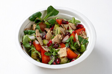 fattouch Fresh and rich salad made with quinoa and halloumi, it is from the Lebanese tradition. with pittas, cucumbers, cherry tomatoes, onion, mint and dill, seen up close and isolated on a white bac