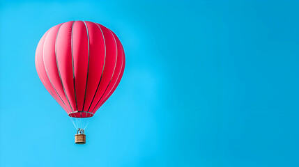 Obraz premium Pink Hot Air Balloon Ascending in a Clear Blue Sky