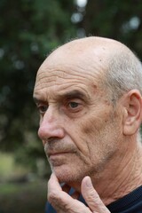 Uncomfortable Elderly Man Cannot Walk In Natural Park Under Trees