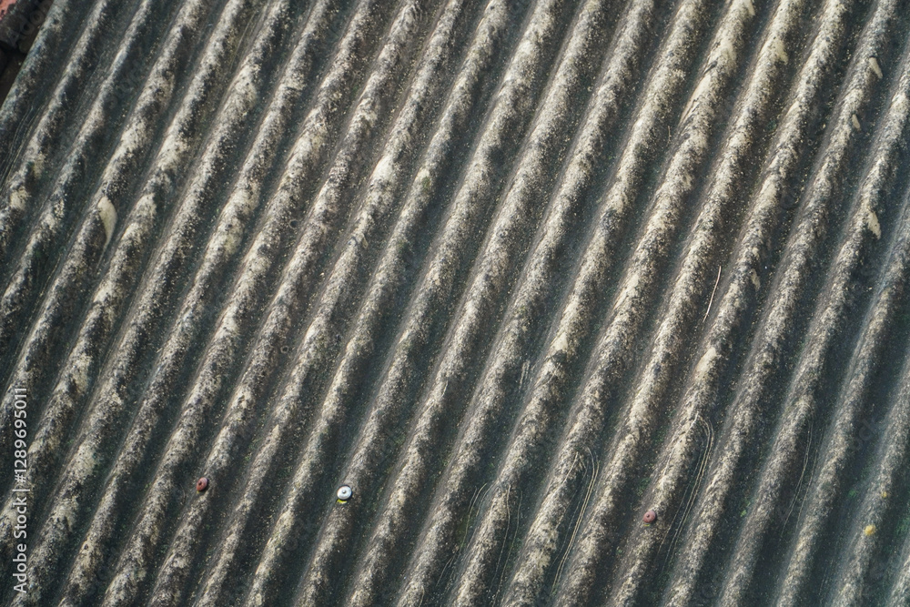 Poster close-up of a weathered corrugated asbestos roof showing texture and patterns. textured corrugated a