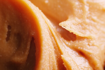Close up of expired peanut butter texture. Eating rancid peanut butter can lead to tummy troubles...