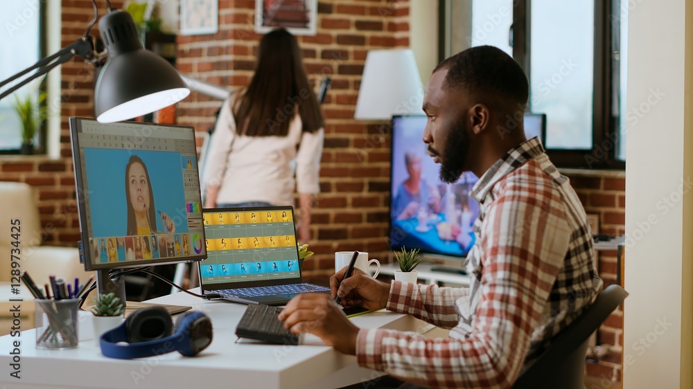 Poster freelance creative graphic editor works remotely editing digital images in his home office setup. wo
