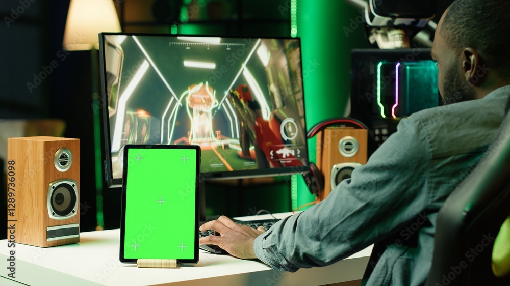 Poster chroma key tablet next to man playing high fps singleplayer videogame with spaceship shooting lasers