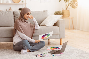 Online Graphic Design Courses. Young Arab Woman In Hijab Holding Colour Gamma Palette And Working...