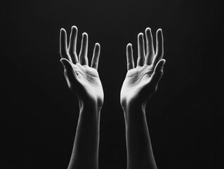 Obraz premium Two Hands Raised Upward in Black and White