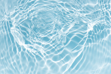 Blue water with ripples on the surface. Defocus blurred transparent blue colored clear calm water...