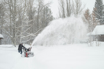 Clearing sidewalk during snowstorm; Grand Teton NP; Wyoming