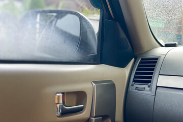 foggy car windshield due to cold air