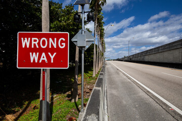 wrong way sign on the road