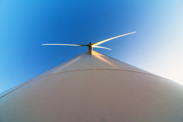 Wind turbine tower low-angle close-up at sunset © AlvaroRT