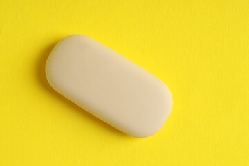 One eraser on yellow background, top view