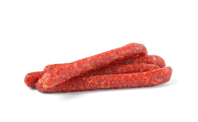 Many thin dry cured sausages isolated on white