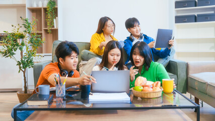 Five young Asian students engage in online study on campus, collaborating on research, projects. They help each other with assignments, gaining valuable experience and preparing for future careers.