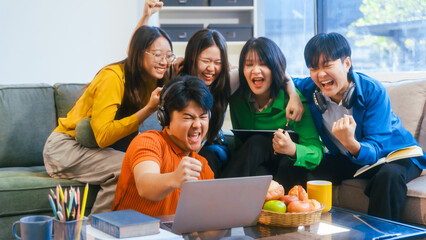 Five young Asian students engage in online study on campus, collaborating on research, projects. They help each other with assignments, gaining valuable experience and preparing for future careers.