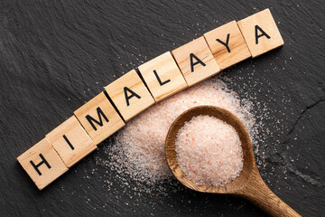 Himalayan pink fine salt - Salt in pure crystals on the spoon.