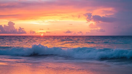 Obraz premium Caribbean sunset with orange and pink hues, calm waves, and a clean horizon, evoking serenity and natural beauty. 