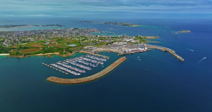 Aerial view of Roscoff cityscape, with Roscoff jetty in the background in northwestern France. Picturesque fishing and tourist town on the Atlantic coast Roscoff in the sunset