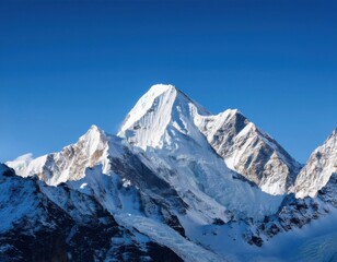 Obraz premium awe inspiring and grandeur inducing sight of a snow-covered mountain with its white peaks against a backdrop of a clear blue sky