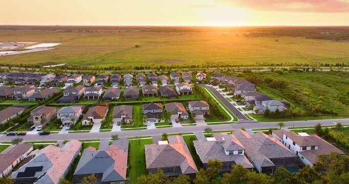 Large residential homes in southwest Florida gated community. American houses in rural US suburbs