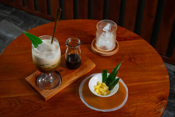 Es Cendol, a traditional indonesian beverage made with coconut milk, added with palm sugar syrup...
