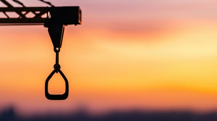 Obraz premium Silhouette of industrial cranes concept. Minimalist Silhouette of a Construction Crane at Dramatic Sunset