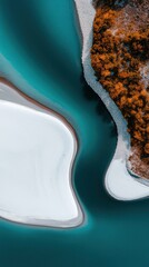 Fototapeta premium Aerial View of Serene Landscape with Winding Turquoise Water, Sandy Areas, and Autumn Trees Bordering Snowy Terrain